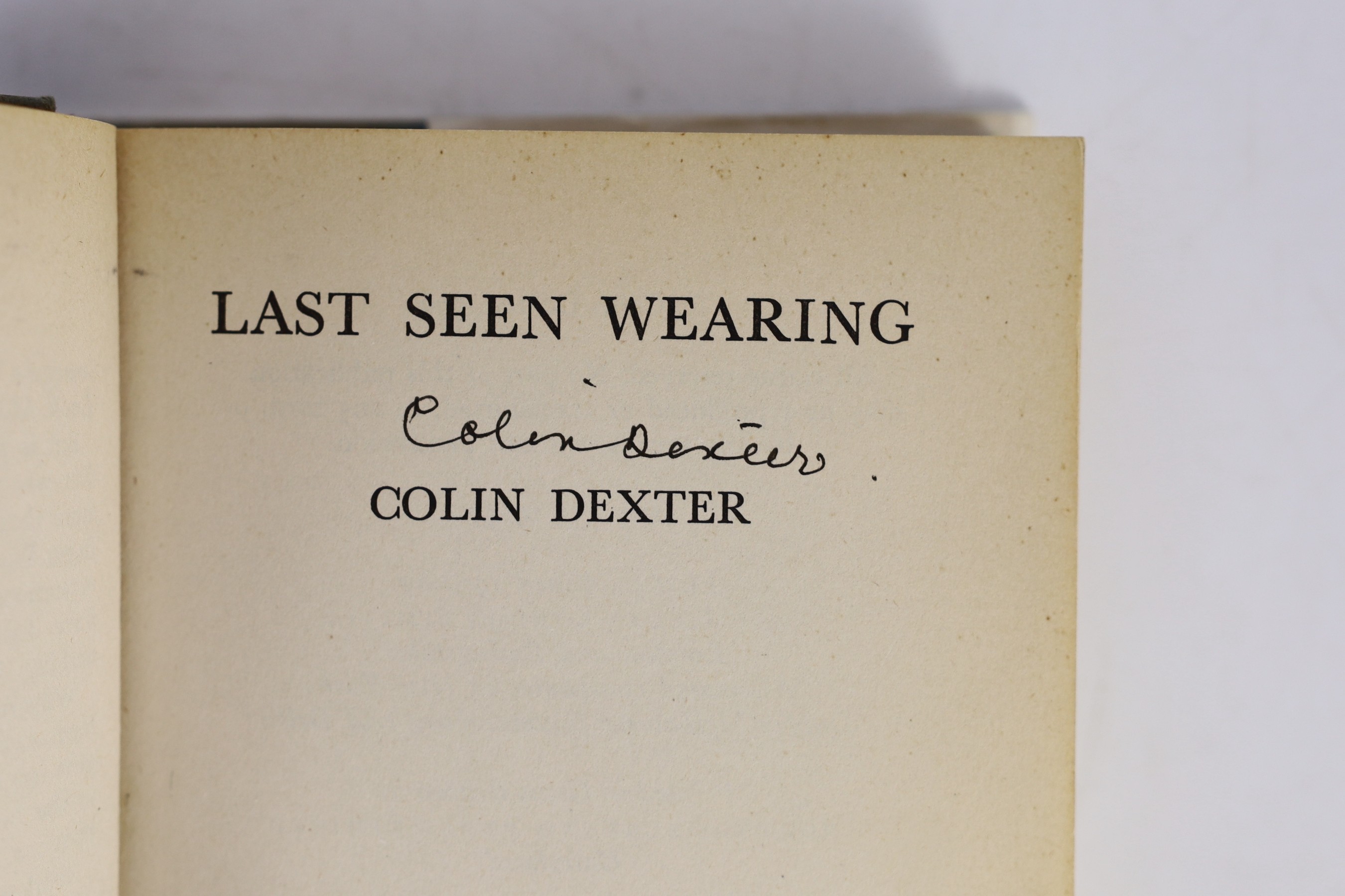 Dexter, Colin - Last Seen Wearing, 1st edition, signed on title page by author, 8vo, original cloth in unclipped d/j, with usual uniform page yellowing to text block and edges, Macmillan, London, 1976